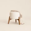 Greta Round Boucle Ottoman with Splayed Wood Legs