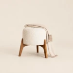 Greta Round Boucle Ottoman with Splayed Wood Legs