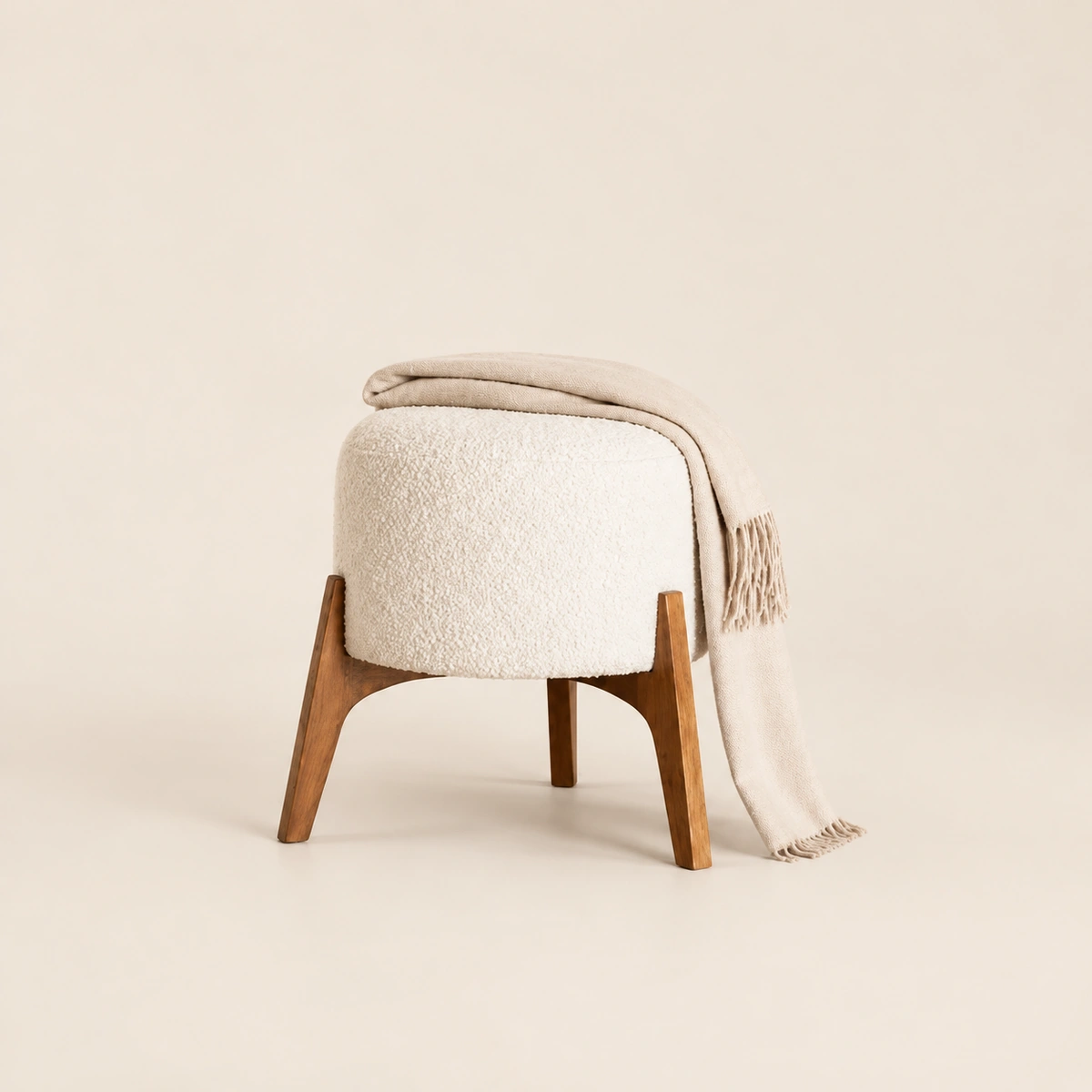 Greta Round Boucle Ottoman with Splayed Wood Legs